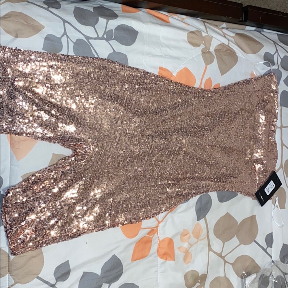 Pink sparkly romper from Fashion Nova.